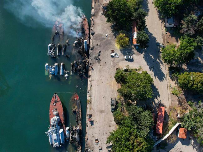 An aerial photo shows Syrian naval ships destroyed during an overnight Israeli attack on the port city of Latakia on December 10, 2024. The UN special envoy for Syria on December 10 called on Israel to halt its military movements and bombardments inside Syria, days after the fall of president Bashar al-Assad. (Photo by AAREF WATAD / AFP)