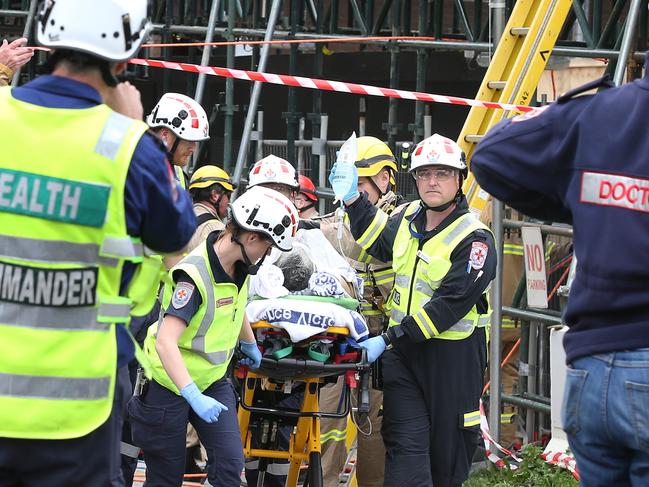 Emergency services are currently responding to an incident at a construction site on Whitehorse Road, Box Hill.It is understood a crane, which was transporting a tub of concrete, dropped its load into a pit where three men were working about 12.20pm.Two men have been removed, with one sustaining critical injuries and the other minor injuries.The third man remains trapped.  Picture: David Caird