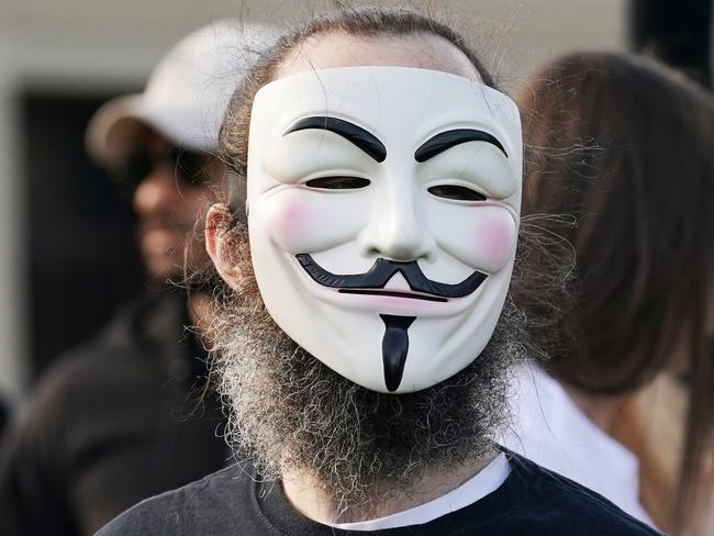 People protest during the 'Wake Up Australia!' march against mandatory vaccinations at the Botanical Gardens in Melbourne, Saturday, May 30, 2020. (AAP Image/Michael Dodge) NO ARCHIVING