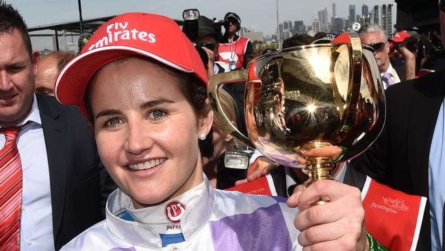 Michelle Payne celebrates after becoming the first female jockey to win the Melbourne Cup, on Prince of Penzance in 2015. Picture: AAP