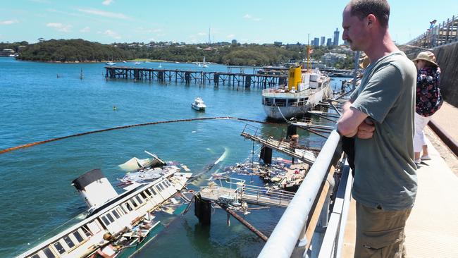 Daniel Callender, the ship keeper of the MV Cape Don, pictured next to the Baragoola.