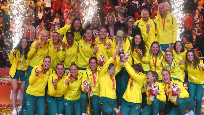 TOPSHOT - Australian players hold their trophy as they celebrate winning the final of the Netball World Cup against England, in Cape Town on 06 August 2023. (Photo by RODGER BOSCH / AFP)