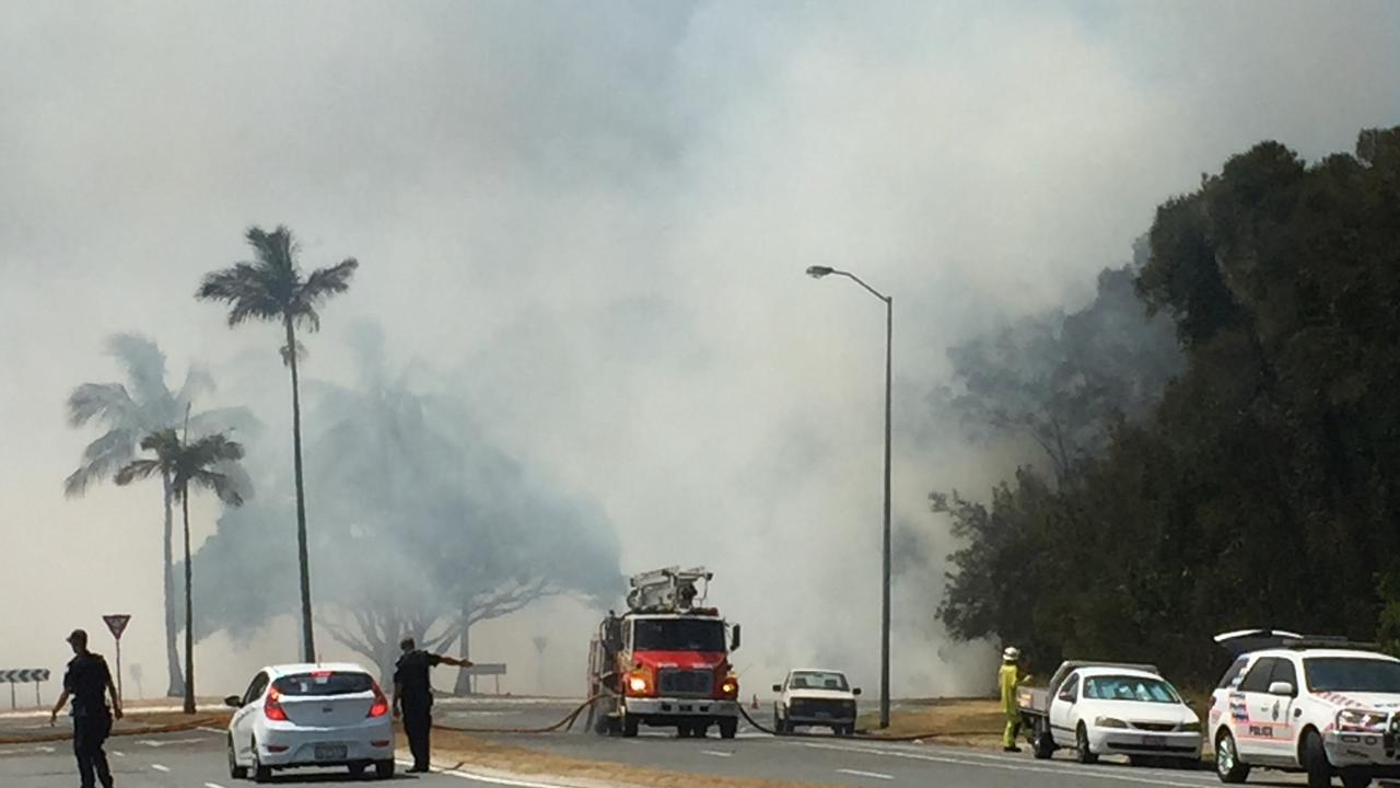 Firies battling the blaze on Seaworld Drive. Picture: Talisa Eley