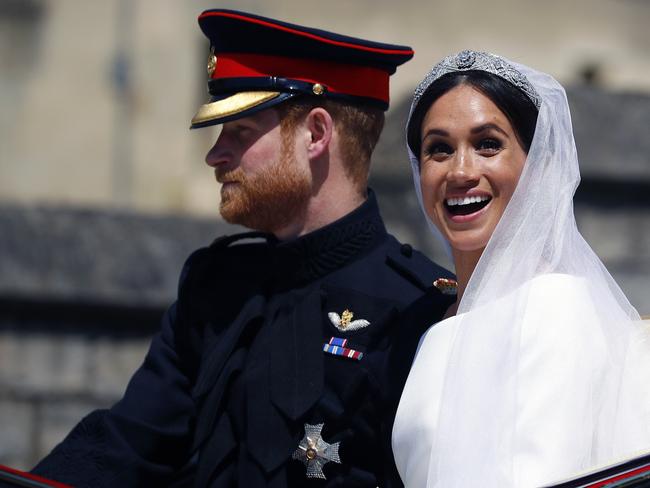 Meghan Markle seemed overjoyed to be in the carriage. Picture: Getty Images