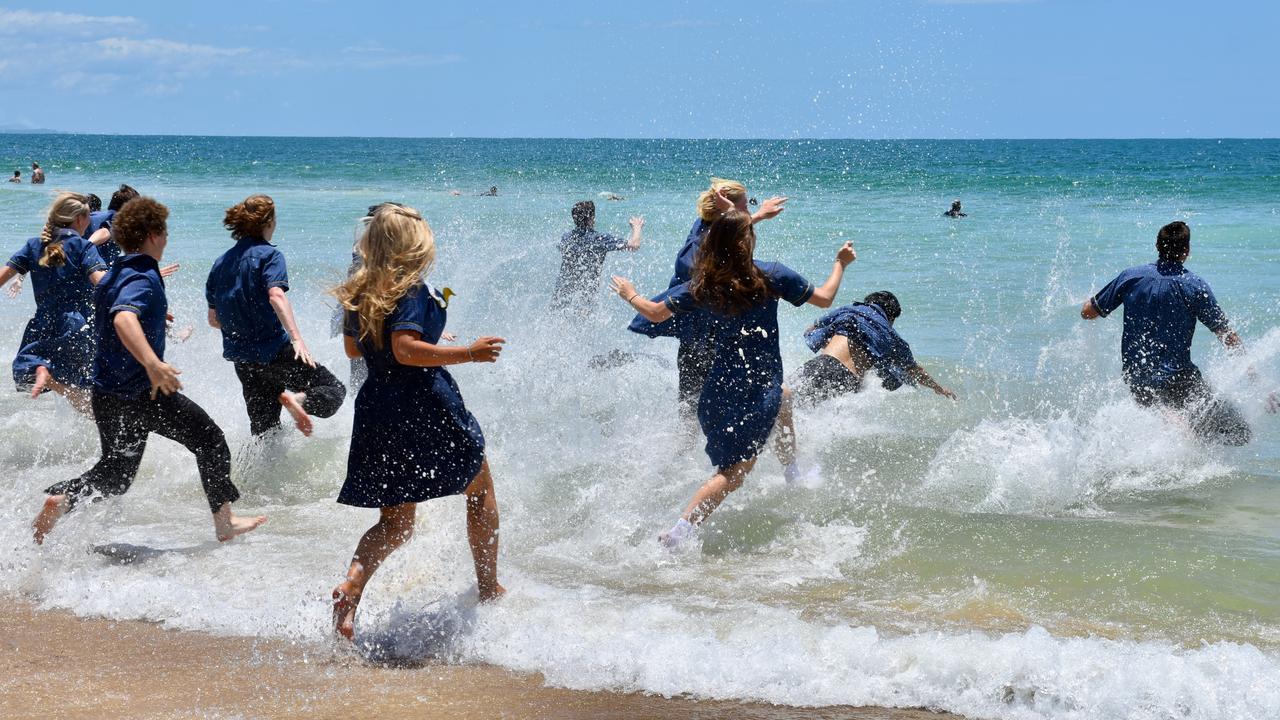 Year 12 graduates from schools across the Sunshine Coast hit to the water at Mooloolaba Beach to celebrate the end of their schooling. Photo: Mark Furler