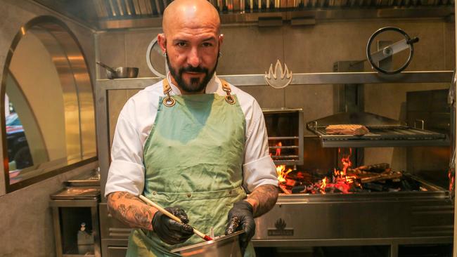 Camilo Rodriguez Cardenas on the wood fired Grill as Kōst opens on the Gold Coast this weekend. Picture: Glenn Campbell