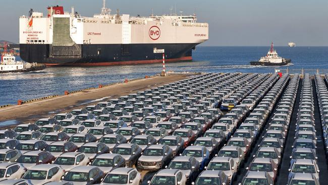 Electric cars ready to be loaded for export in China. Picture: AFP