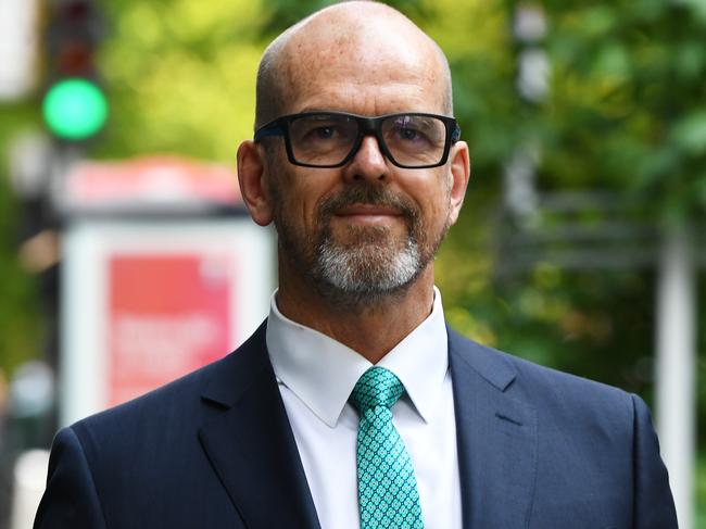 Former Victoria Police Chief Commissioner Simon Overland arrives to the Royal Commission into the Management of Police Informants at the Fair Work Commission in Melbourne, Tuesday, December 17, 2019. (AAP Image/James Ross) NO ARCHIVING