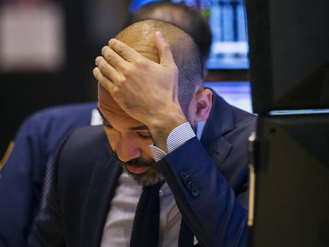 A trader works on the floor of the New York Stock Exchange shortly after the opening of the markets in New York October 14, 2015. REUTERS/Lucas Jackson