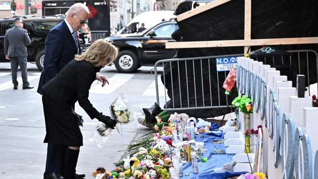 US President Joe Biden and First Lady Jill Biden lay flowers as they pay their respects to victims of the January 1 truck attack at a makeshift memorial in Bourbon Street in New Orleans, Louisiana, on January 6. Picture: AFP