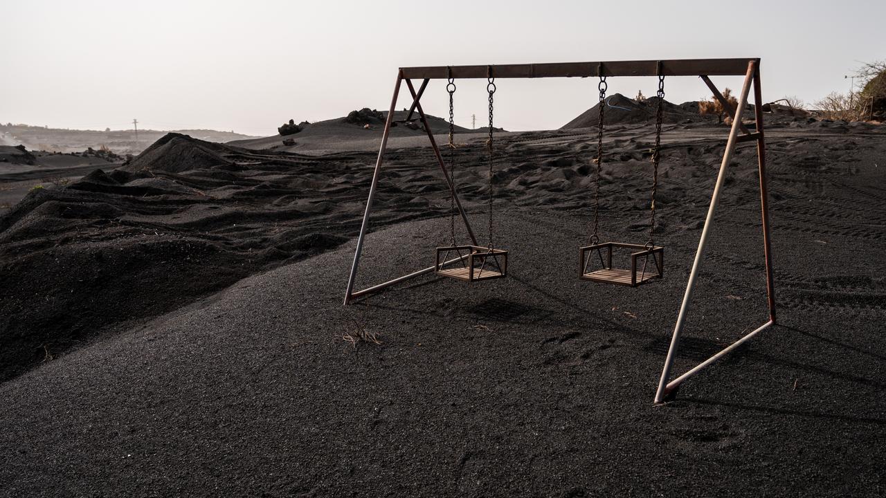 A swing is seen isolated by the lava on January 31, 2022 in La Palma. Picture: by Marcos del Mazo/Getty Images