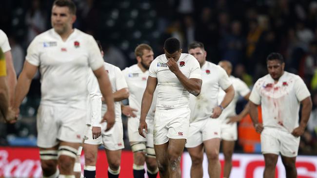 England's wing Anthony Watson (C) reacts after losing a Pool A match of the 2015 Rugby World Cup between England and Australia at Twickenham stadium, south west London, on October 3, 2015. AFP PHOTO / ADRIAN DENNIS RESTRICTED TO EDITORIAL USE, NO USE IN LIVE MATCH TRACKING SERVICES, TO BE USED AS NON-SEQUENTIAL STILLS