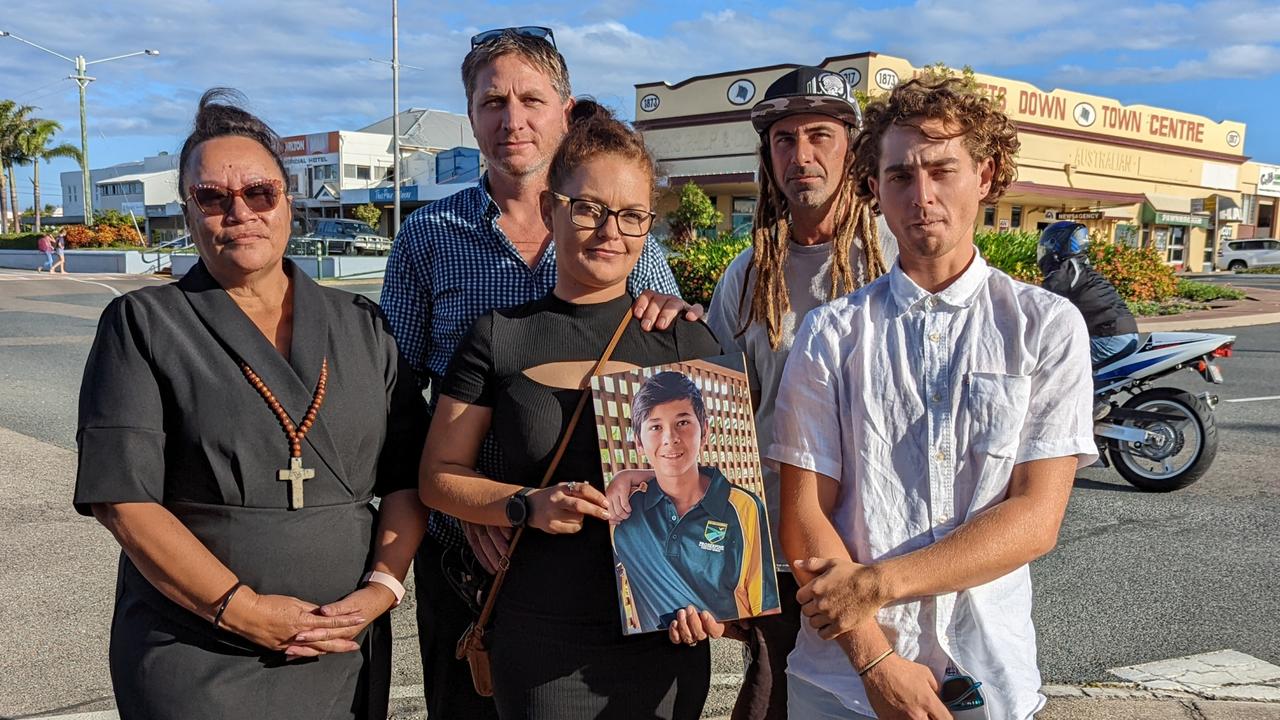 The family of 13-year-old Bailey Pini stand together holding his portrait, after the final day of the coronial inquest into his death in Bowen. (L to R): Aunt Angela Styles, brother-in-law Luke Jackson, sister Troydon Pini and brothers Kaylen and Jericho.