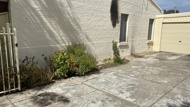 Burn marks at the scene of a molotov cocktail attack on a house at Jervois St, Torrensville on Monday morning. Picture: Paul Ashenden