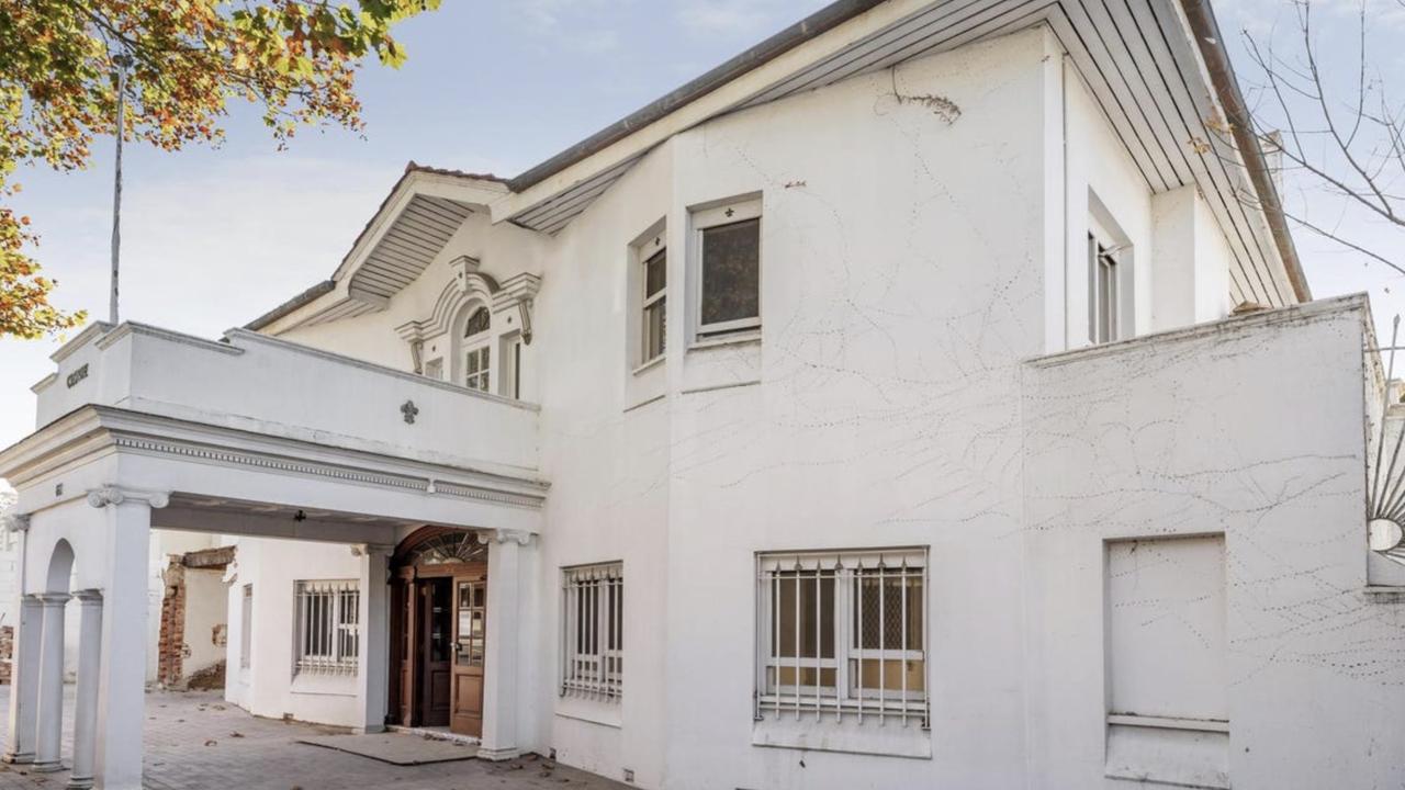 Peeling render, weathered columns and overgrown gardens now shroud the home’s former elegance, though its proportions still impress.