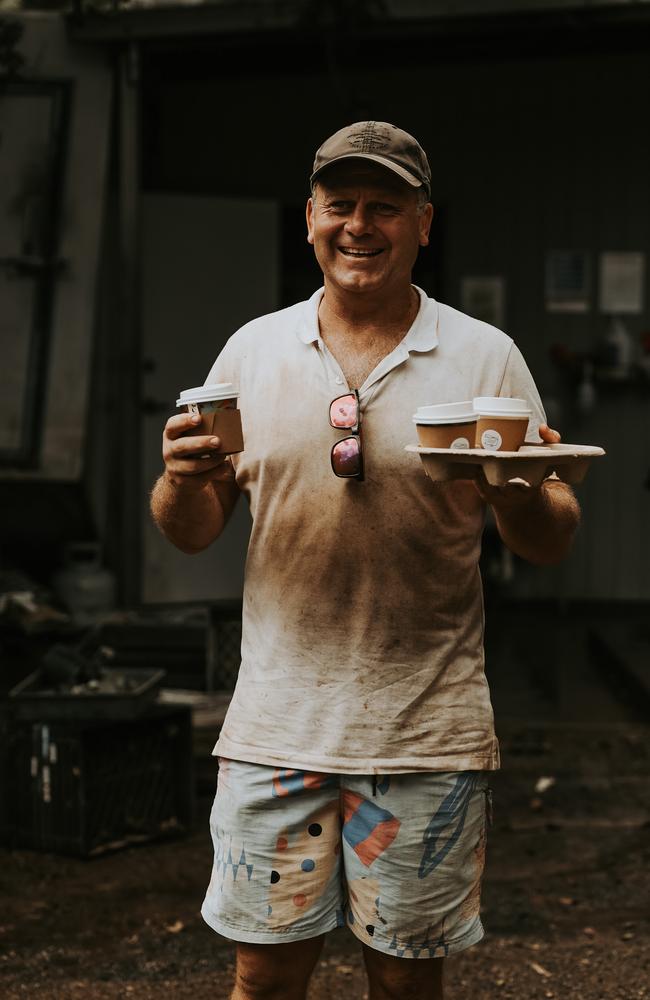 Doug Smith helping clean up at Brookfield Gardens. Picture: Allie Lee