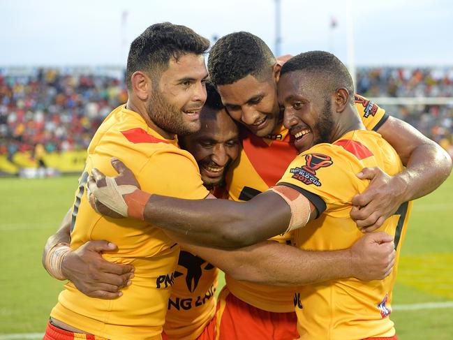 PORT MORESBY, PAPUA NEW GUINEA - NOVEMBER 05:  (L-R) Rhyse Martin, Justin Olam, Nene McDonald and Watson Boas of Papua New Guinea celebrate victory after the 2017 Rugby League World Cup match between Papua New Guinea Kumuls and Ireland on November 5, 2017 in Port Moresby, Papua New Guinea.  (Photo by Bradley Kanaris/Getty Images)