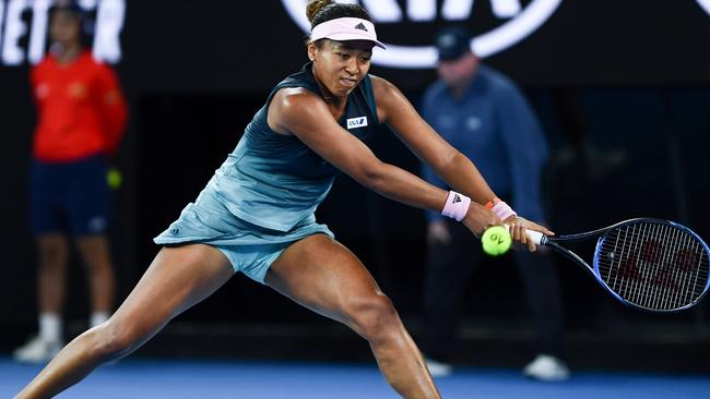 Japan's Naomi Osaka hits a return against Czech Republic's Karolina Pliskova.