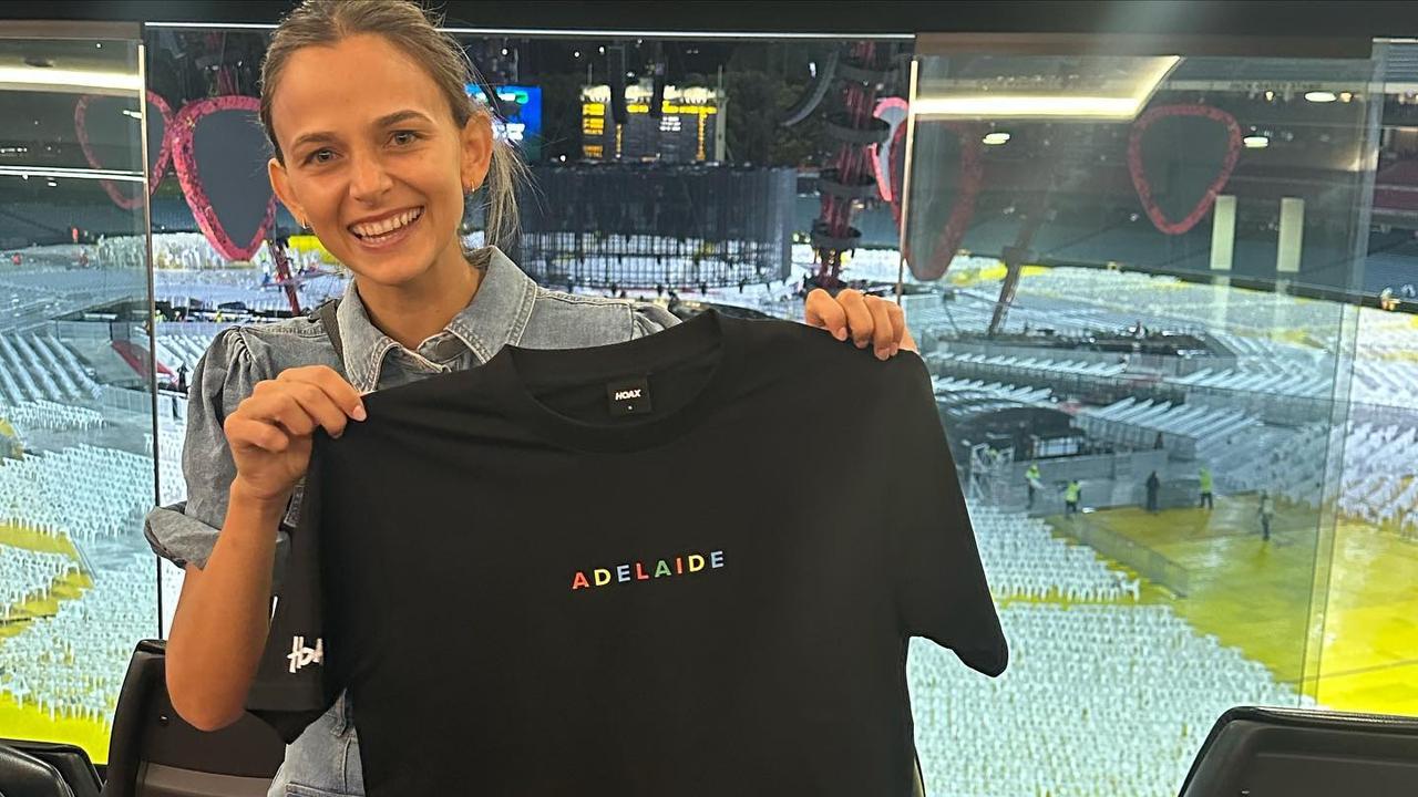 Kellie Finlayson with a T-shirt given to her by Ed Sheeran.