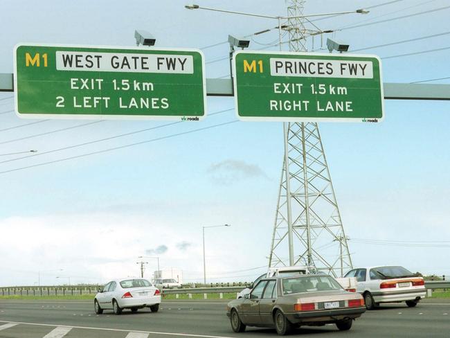 Speed cameras above signs on the inbound lanes of the Western Ring Rd, near the Boundary Road exit, Laverton North.