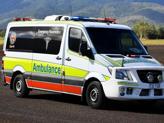Emergency services attend a fatal car crash on the Bruce Highway, south of Townsville at Mount Surround. Garbage truck driver being looked over by paramedics.  Picture: Alix Sweeney