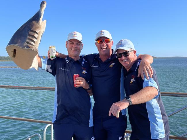 Mornington Peninsula players Andrew Shannon (left), Chris Lanting (middle) and Brendon Gardner with the Hammerhead (the trophy for man-of-the-match) on the ferry back from French Island. Picture: Supplied