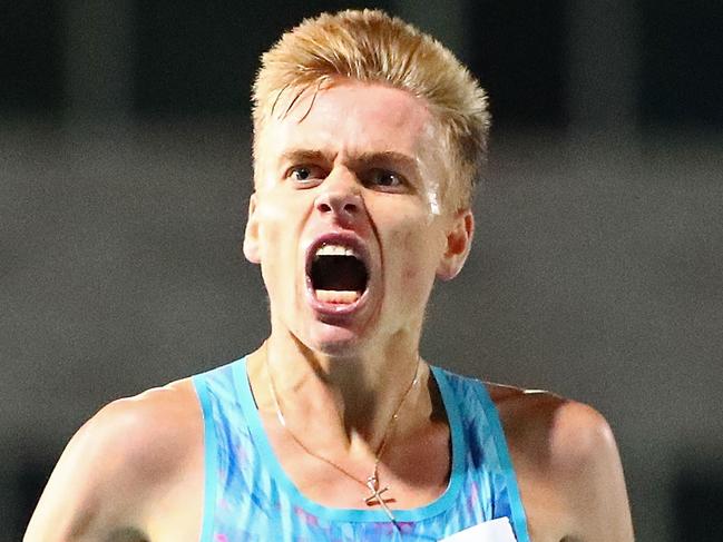 MELBOURNE, AUSTRALIA - DECEMBER 14:  Stewart  Mcsweyn of Tasmania crosses the finish line to win the Mens 10000 Meter Run Open Zatopek race during Zatopek 10 at Lakeside Stadium on December 14, 2017 in Melbourne, Australia.  (Photo by Scott Barbour/Getty Images)