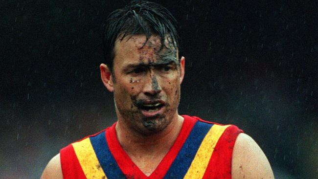 Todd Viney covered with mud during the final State of Origin game in 1999. Picture: Graham Crouch.