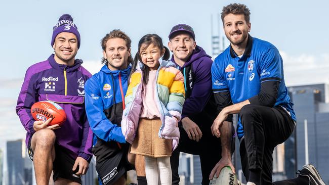 Liver transplant recipient Chloe Loo-Tandiyono kicked off the Great Registration Race with DonateLife ambassadors from the Western Bulldogs and Melbourne Storm, Jahrome Hughes, Caleb Daniel, Cooper Johns and Marcus Bontempelli. Picture: Jake Nowakowski