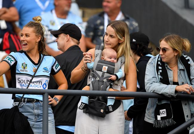 Fans watch on during the sell-out clash at Shark Park.