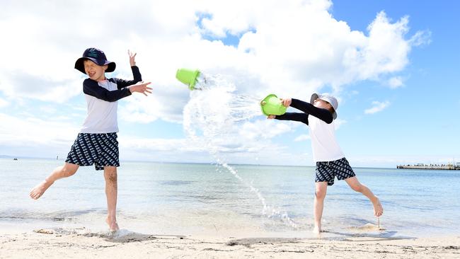 Reuben and Marcel Deppeler having fun at Portarlington beach. Picture: David Smith