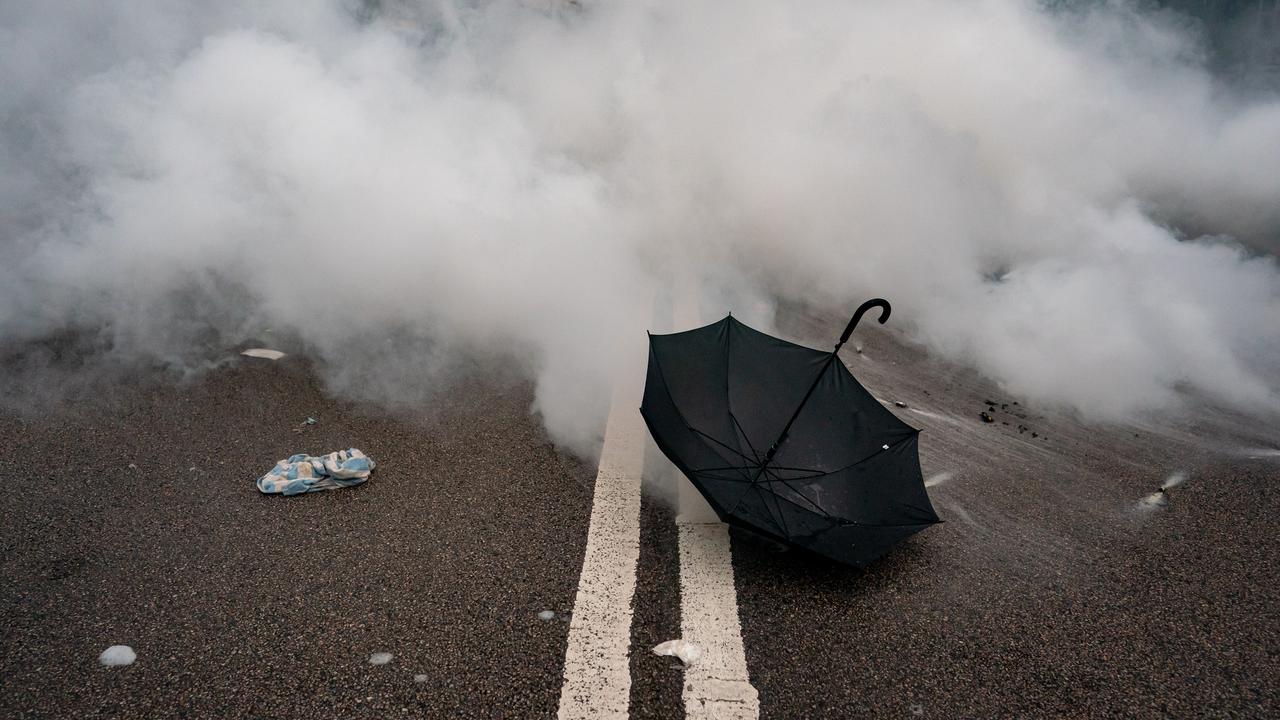 An umbrella is seen in front of teargas during a demonstration on June 12, 2019 in Hong Kong, Hong Kong.