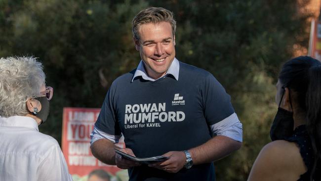 Liberal candidate in the Adelaide Hills seat of Kavel, Rowan Mumford, handing out how to vote cards at Mount Barker High School on state election day. Picture: Naomi Jellicoe