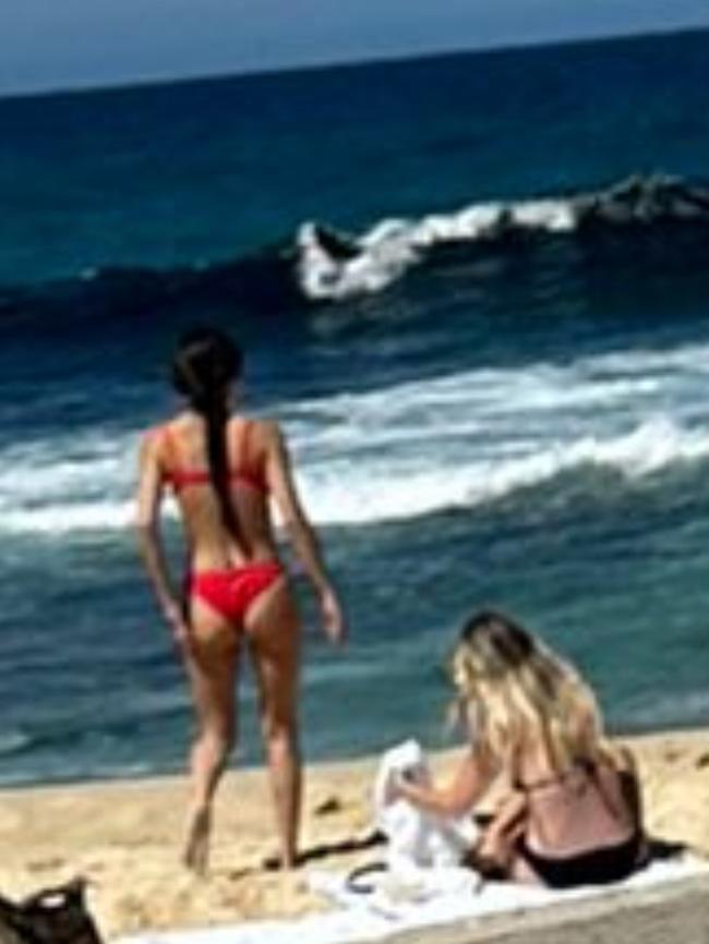 Rodrigo, (red bikini) also went for a dip. Picture: Willow Berry