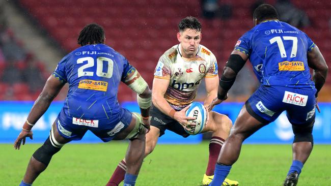 BRISBANE, AUSTRALIA - MAY 31: Lachie Anderson of the Reds looks to take on the defence during the round 16 Super Rugby Pacific match between Queensland Reds and Fijian Drua at Suncorp Stadium, on May 31, 2025, in Brisbane, Australia. (Photo by Bradley Kanaris/Getty Images)