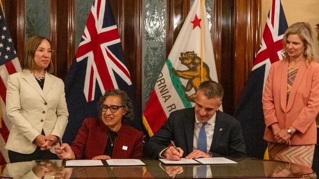 Premier Peter Malinauskas with Tanya Bennett (right), Consul-General of Australia in Los Angeles, and Eleni Kounalakis (left), Lieutenant Governor of California, and signing the document is Liane Randolph, California Air Resources Board Chair. Picture: Supplied