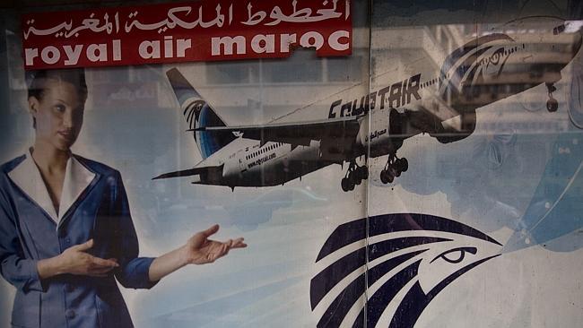An advertisement promoting EgyptAir on the outside of a travel agency in Cairo.