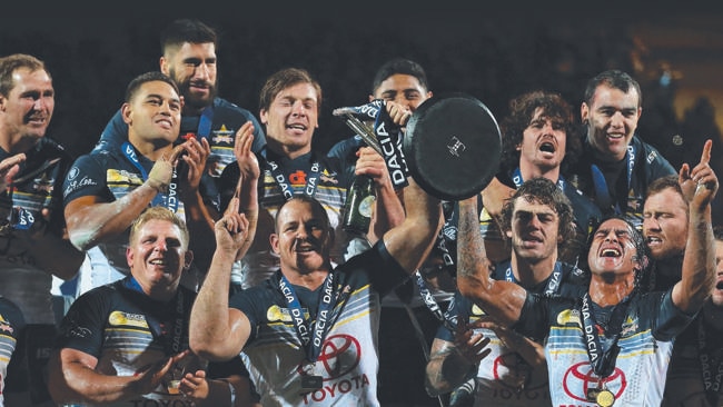 LEEDS, ENGLAND - FEBRUARY 21: Johnathan Thurston and Matthew Scott of North Queensland Cowboys lift the World Club Series trophy after victory over Leeds Rhinos in the World Club Series match between Leeds Rhinos and North Queensland Cowboys at Headingley on February 21, 2016 in Leeds, England. (Photo by Alex Livesey/Getty Images)