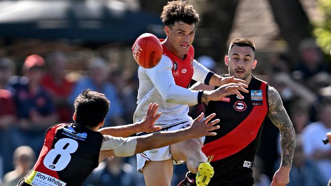 Dale Marshall gets a kick for Diamond Creek. Picture: Andy Brownbill