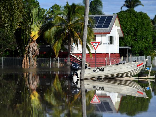 A boat on a trailer sits in floodwaters ready to use as the waters use. Picture: AAP.