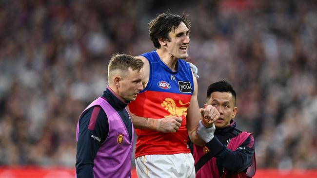 Oscar McInerney of the Lions receives medical attention after injuring his shoulder. Picture: Quinn Rooney/Getty Images