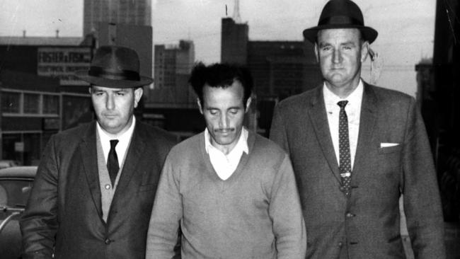 MAY 14, 1963 : Police officers Detective sergeants James Black (L) & Jack Ford arrest William McDonald, (aka The Mutilator) to question him at Police Headquarters in Russell Street, Melbourne where he was later charged with killing four Sydney drunks in 1961-1962. NSW / Crime / MurderVictoria