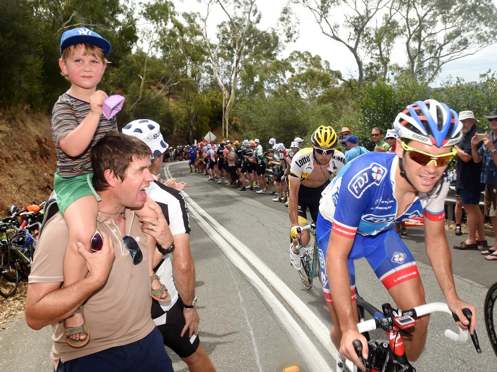 Fans cheer on the riders. Photo: Tom Huntley.