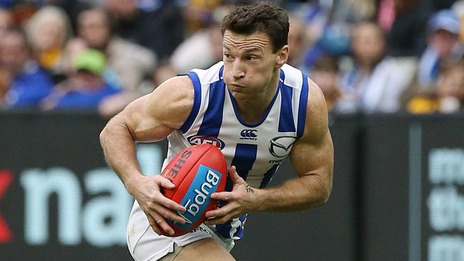 Brent Harvey in action against Hawthorn. Picture: Wayne Ludbey