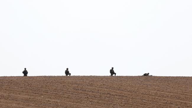 Israeli troops take position at the border with Gaza in southern Israel. Picture: Jack Guez/AFP