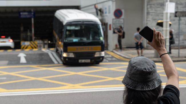 A prison van with the five speech therapists aboard leaves Hong Kong’s Wanchai district court complex on Saturday. Picture: AFP