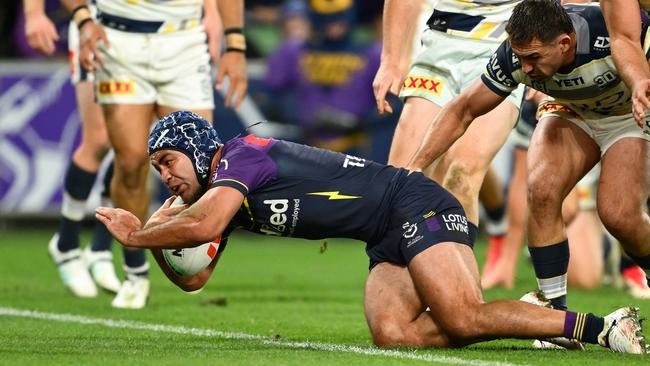 MELBOURNE, AUSTRALIA - JUNE 06: Jahrome Hughes of the Storm scores a try during the round 14 NRL match between Melbourne Storm and North Queensland Cowboys at AAMI Park, on June 06, 2025, in Melbourne, Australia. (Photo by Quinn Rooney/Getty Images)