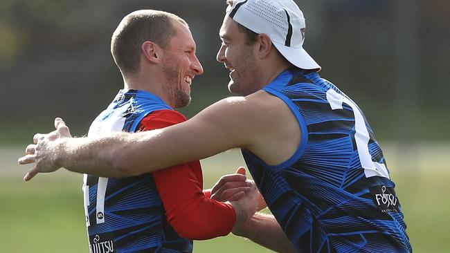 James Kelly gets a hug from teammate Tom Bellchambers following his retirement announcement. Picture: Getty Images