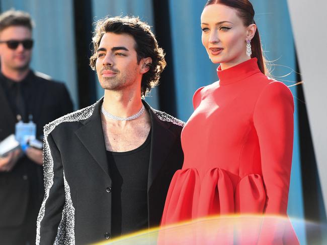 Joe Jonas and Sophie Turner attend the 2022 Vanity Fair Oscar Party in Beverly Hills. (Photo by Patrick T. FALLON / AFP)