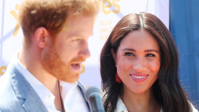 JOHANNESBURG, SOUTH AFRICA - OCTOBER 02: Meghan, Duchess of Sussex looks on as Prince Harry, Duke of Sussex speaks during a visit a township to learn about Youth Employment Services on October 02, 2019 in Johannesburg, South Africa.  (Photo by Chris Jackson/Getty Images)